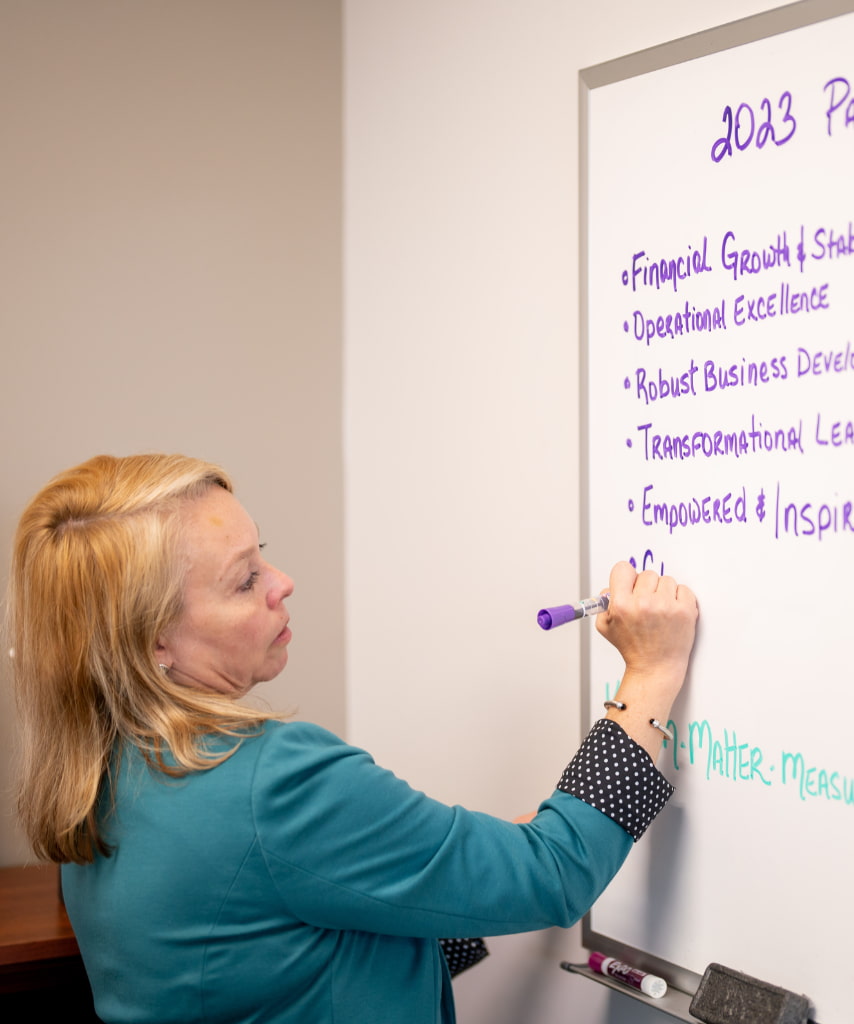 Melissa Labor-CPO-writing-on-a-whiteboard
