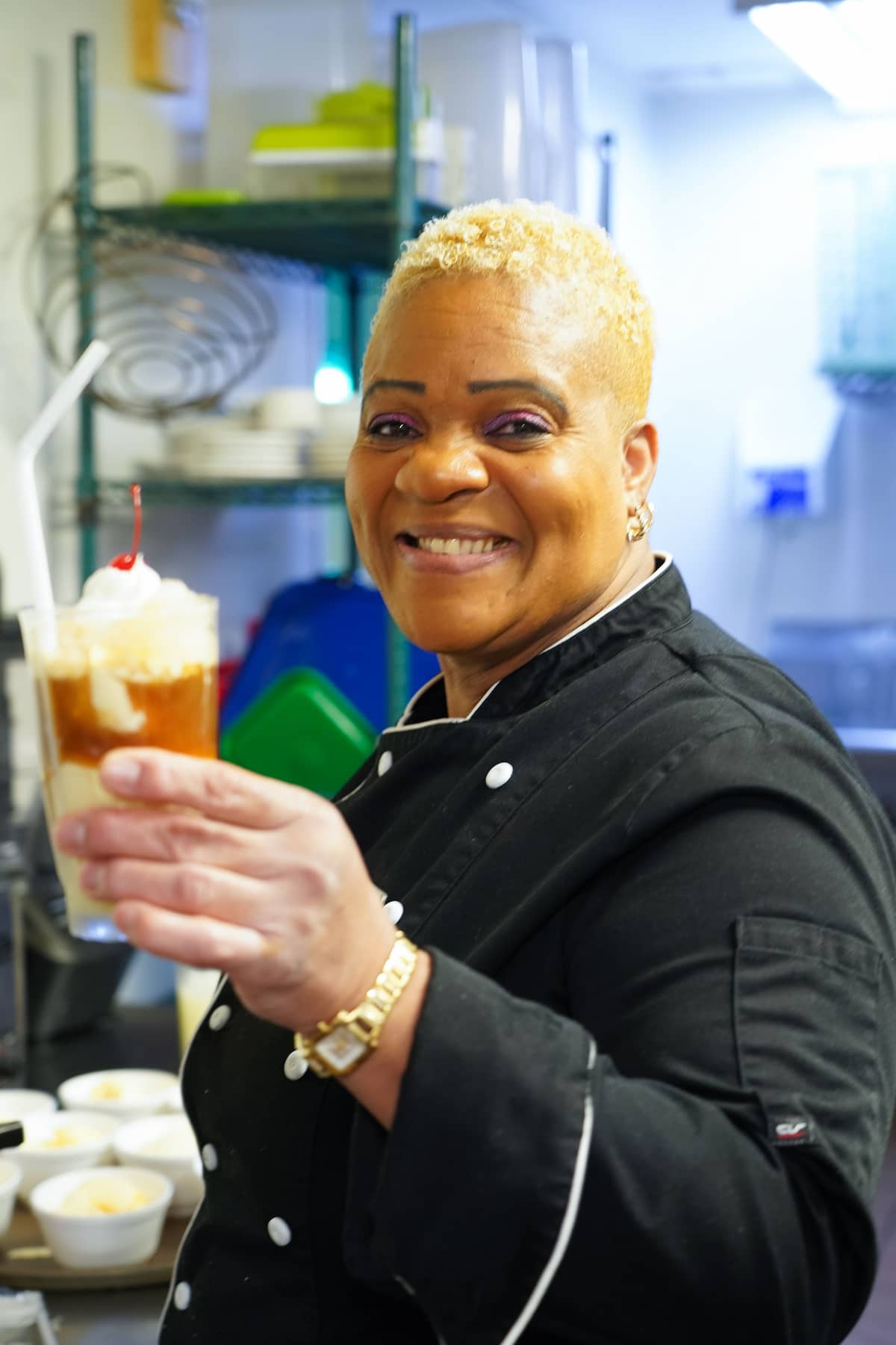 A server prepares a dessert for residents